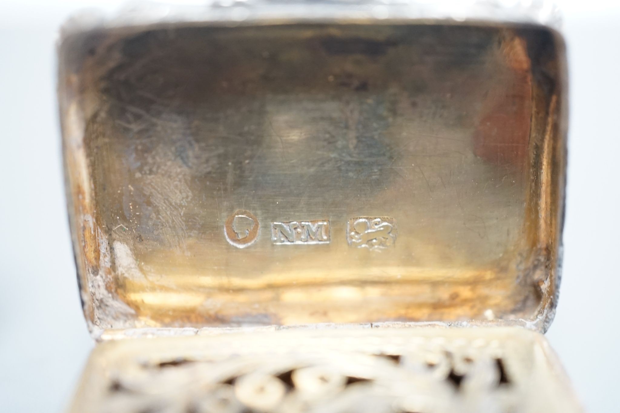 An early Victorian engraved silver shaped rectangular vinaigrette, by Nathaniel Mills, Birmingham, 1844, 31mm and a later silver vinaigrette by George Unite.